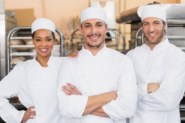 Three chefs smiling